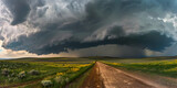 Fototapeta  - Rainfall in the distance on the prairies under ominous storm clouds, Storm clouds over golden field, ripened crops

