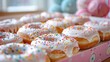 photo of donuts with white cream with colorful toppings, in a cute box
