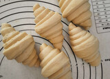 Fototapeta Perspektywa 3d - Croissant dough is ready in the oven.