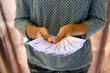 Woman counting money in her hands Selective focus on money
