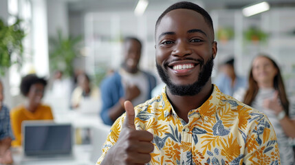 Wall Mural - Portrait of happy African American business leader in casual shirt giving thumbs up, group of diverse office workers are in blurry background