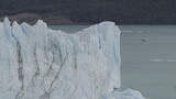 Fototapeta Las - Tourists Approaching the Majestic Perito Moreno Glacier by Boat