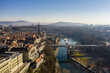 Bern, Switzerland: Aerial view of Bern old town skyline with the cathedral and the Kirchenfeld bridge over the Aar river on a moody winter morning