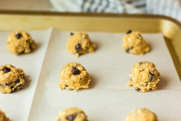 Wall Mural - Oatmeal cookie dough scoops on baking sheet