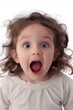 Close-up of a young girl with wide eyes and open mouth, expressing surprise or excitement.