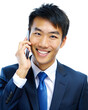 A business Asian man is talking on a cell phone. The file is in PNG format
