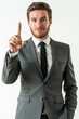 Young professional man in a suit pointing up with confidence.