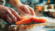 Chef Seasoning Fresh Salmon Fillet in Professional Kitchen
