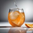 A glass of fizzy orange soda with an orange slice1