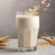 A glass of creamy oat milk with a sprinkle of nutmeg5