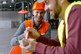 Fototapeta  - Attractive, smiling workers holding lunch boxes, eating lunch, food, chatting with each other