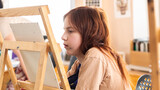 Fototapeta Kosmos - Cute girl in art studio painting oil painting. Hobbies, Relaxation, Art Therapy
