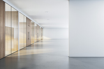 Wall Mural - modern office interior corridor with glass partitions, wood paneling, and an empty white wall for mo