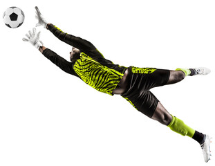 Wall Mural - Young African man, football player, goalkeeper catching ball in jump during game isolated on transparent background. Concept of sport, game, competition, tournament, active lifestyle