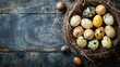 A variety of speckled Easter eggs gathered in a nest on a wooden background.
