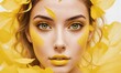 Close up portrait beautiful woman with creative yellow make up, yellow leaves and petals around