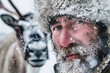 Male reindeer herder in snow