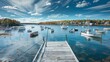 GEORGETOWN, MAINE - OCTOBER 14, 2017: A view from a fishing dock overlooking numerous boats moored in blue waters of picturesque Sheepscot Bay.
