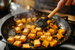 Generative AI Image of Cooking Sauteed Tofu with Spatula in Kitchen