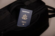 Close up of an American passport in a black travel bag pocket