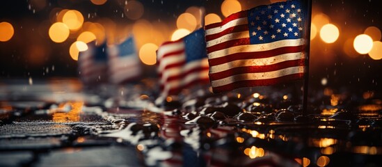 The American flag is illuminated by a soft glow, with bokeh lights creating a festive background