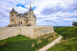 Castle Saumur, France, located at the Loire river under a beautiful sunny cloudscape during daytime.