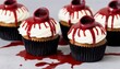 Spooky Halloween themed cupcakes with fake blood and cuts