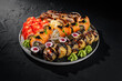 Assorted sushi platter on dark background
