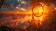 Dream catcher hangs from tree in woods at sunset, under colorful sky