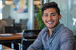 © AI_images - With assurance, a young Latina male entrepreneur smiles confidently in the office boardroom meeting, showcasing his strategic thinking and determination.