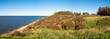 Autumn view of west coast cliffs and covered hills on Livo island, Limfjord, Nordjylland, Denmark