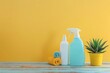 House cleaning product on wood table with yellow background, home service or housekeeping concept
