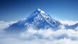 Majestic snowy mountain peak towering above the clouds