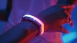 Closeup of a wristband with a builtin UV light that mimics natural sunlight helping to combat seasonal affective disorder and boost mood. .
