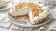 No bake, Creamy Courtyard Pie on a white plate with a slice cut with a silver knife and fork