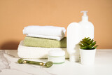 Fototapeta Mapy - Spa products in the bathroom. Shampoo, cream, towels. Natural cosmetic background.