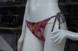 Closeup of printed cheeky of bikini on mannequin in a fashion store showroom