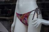 Fototapeta Sypialnia - Closeup of printed cheeky of bikini on mannequin in a fashion store showroom
