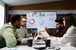 © YURII MASLAK - A team of young mixed race businessmen working on a startup. Business strategy, teamwork. Discussion and generation of ideas. Communication network. multinational professional team.
