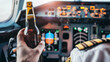 © Kondor83 - Grotesque image of a commercial pilot drinking beer in flight