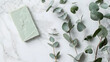 Peeling green herbal soap with empty paper cover and dried eucalyptus twigs on white marble table background Bath body care handcraft product or spa wellness concept Mockup card with c : Generative AI