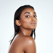 © peopleimages.com - Studio, portrait and Indian woman with natural beauty from dermatology in mockup space. Face, skincare and girl with confidence from glow on skin or pride from healthy cosmetics in white background