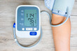 Man check blood pressure monitor and heart rate monitor with digital pressure gauge. Health care and Medical concept	