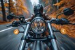 An exhilarating perspective of a motorcyclist riding through a forest, enveloped by the warm hues of autumn leaves falling