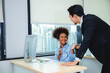 © chokniti - Customer service, call center or telemarketing team and manager or mentor looking happy reading online feedback or sale on website. Diversity people, support sales consultant training office
