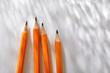 © Tetra Images - Overhead view of pencils on white background