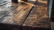 A detailed close-up shot of a weathered wooden bench, showcasing its natural texture and grain