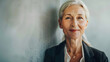 © Generative AI - Minimal waist up portrait of smiling senior businesswoman looking at camera against wall copy space : Generative AI