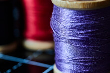 Vibrant Purple Thread Spool Texture With Red Contrast, Macro Side View