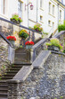 Flowers on the stairs leading to a house in Bouillon, Belgium